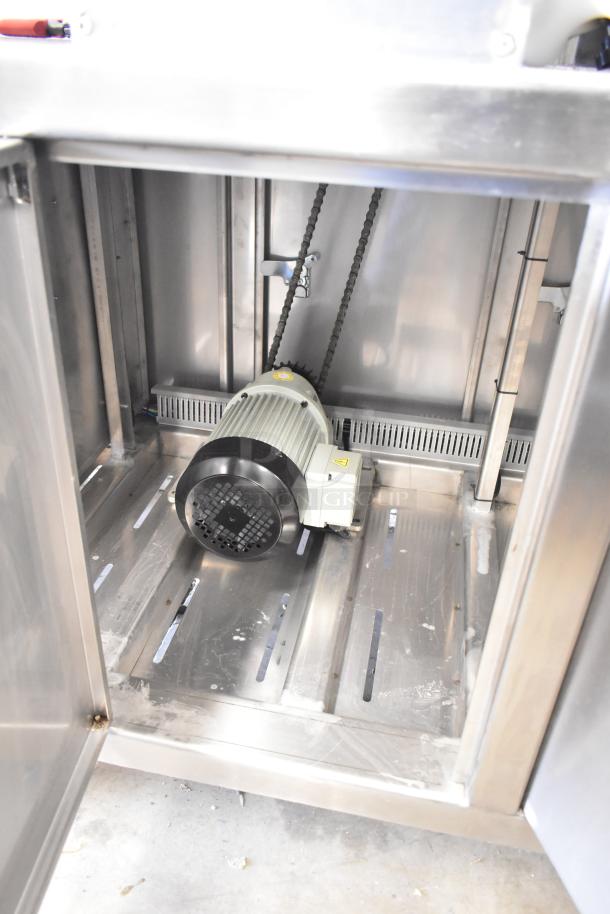 Seny SY-860 bread making machine interior view, showcasing motor and chain mechanism. Clean, stainless steel finish. 220V.