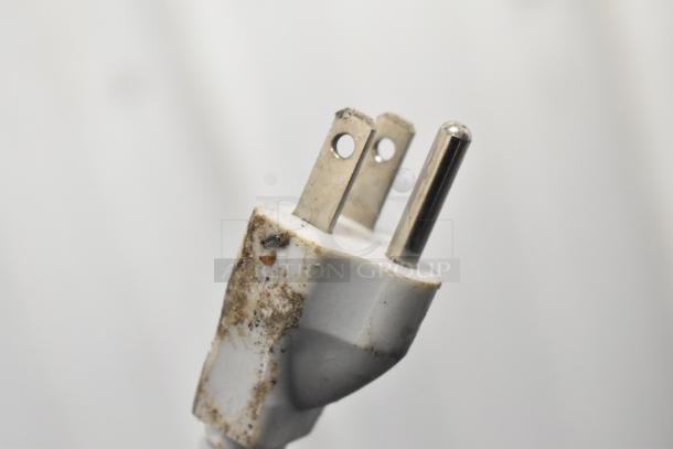 Close-up of a dirty electrical plug for H01GN001 Portable Washing Machine. 110 Volts, 1 Phase. Model H01GN001.