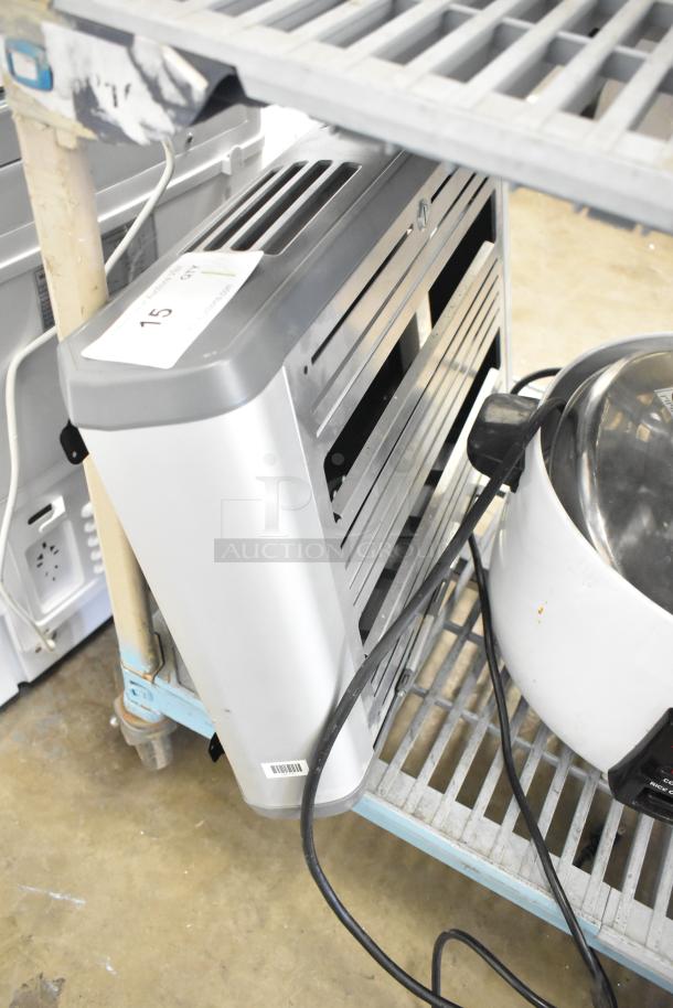 Halo Bug Zapper, 115 Volts, 1 Phase in good condition. Features sleek silver design with visible power cord.