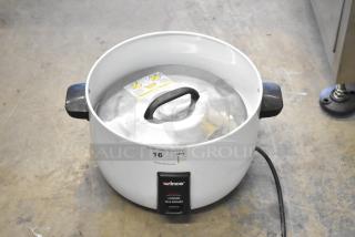 Winco RC-P300 countertop electric rice cooker, white, 110 volts, 1 phase. Shows minor wear with lid and handles visible.