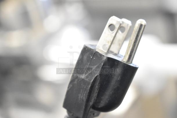 Close-up of a 110-volt plug for the Winco RC-P300 Countertop Electric Rice Cooker. Visible wear on the plug.
