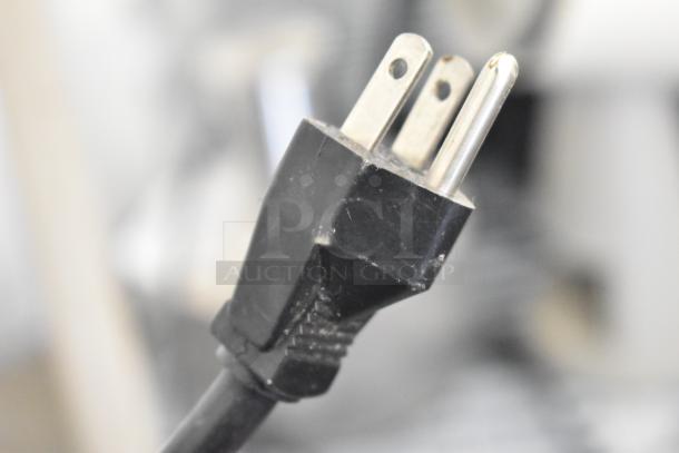 Close-up of a power plug for the Gold Medal 5024 countertop waffle maker, 120 volts, 1 phase.