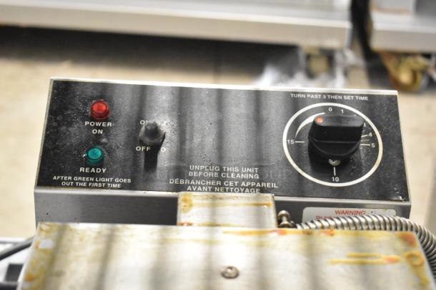 Gold Medal 5024 countertop waffle maker, 120 volts, with control panel showing power and ready lights. Visible wear.