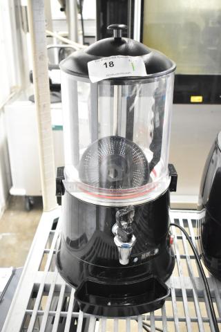 CH10L countertop hot chocolate machine, 110V, 1 phase. Features clear case, spigot, and top cover. Auction tag visible.