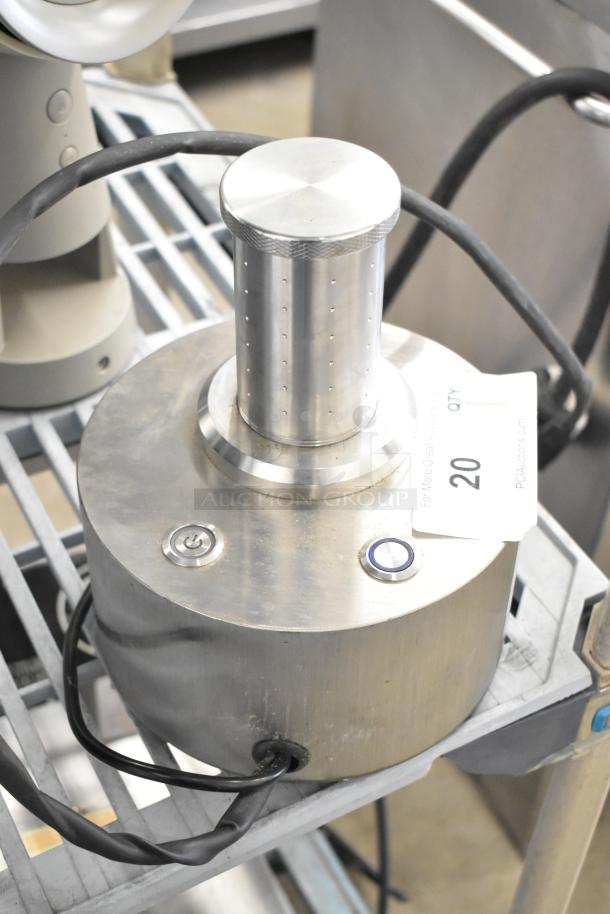 Stainless steel countertop unit, 120 volts, 1 phase, with power button and attached cord. Auction tag with number 20 visible.