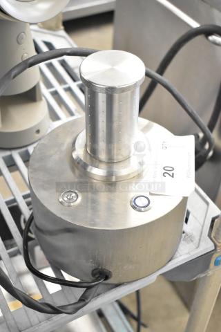 Stainless steel countertop unit, 120 volts, 1 phase, with power button and attached cord. Auction tag with number 20 visible.