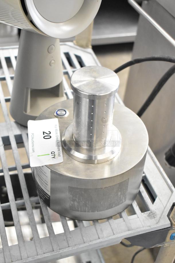 Stainless steel countertop unit, 120 volts, 1 phase. Includes visible label with auction info. Good condition.