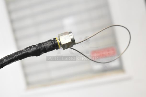 Close-up of a cable with a metal connector, likely part of the countertop unit. Condition is not fully visible.