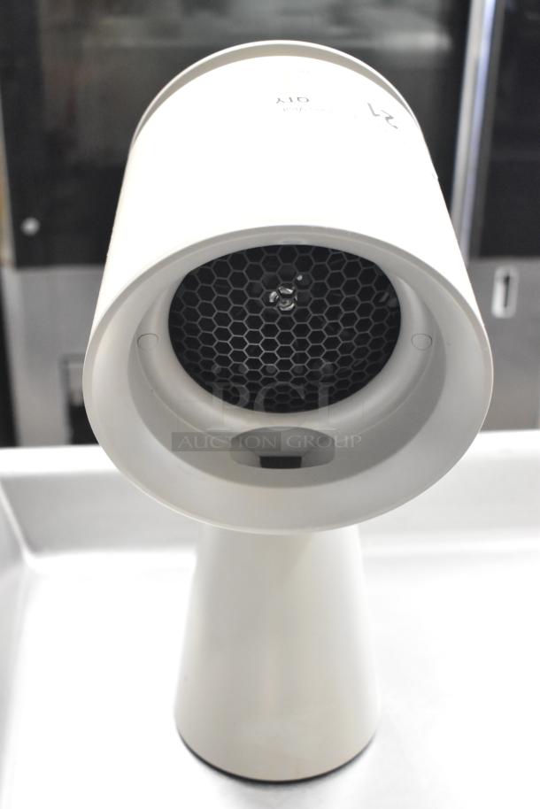Portable countertop range hood with cylindrical design, honeycomb filter, and sleek white finish. Excellent condition.