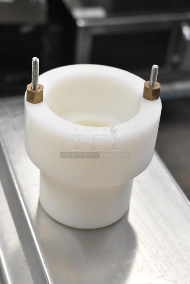 Cookie machine part, made of white plastic with metal bolts, in good condition. Includes 7 items per bid.