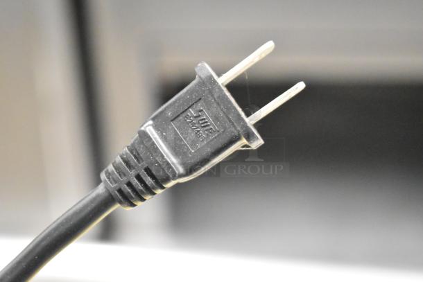 Alt text: Stanley electric stapler/nail gun, visible power cord plug, likely in working condition, suitable for heavy-duty tasks.