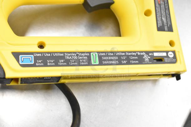 Stanley electric stapler/nail gun, yellow, TRA700 series, supports various staple/brad sizes, UL listed, made in China.
