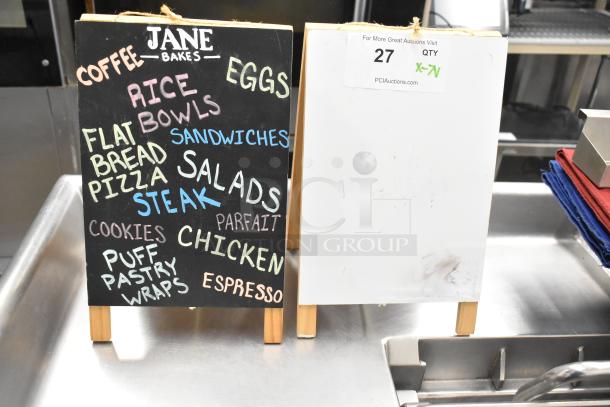 Assorted items including a chalkboard countertop sign with colorful menu items and a plain white sign. Auction tag with quantity 7.