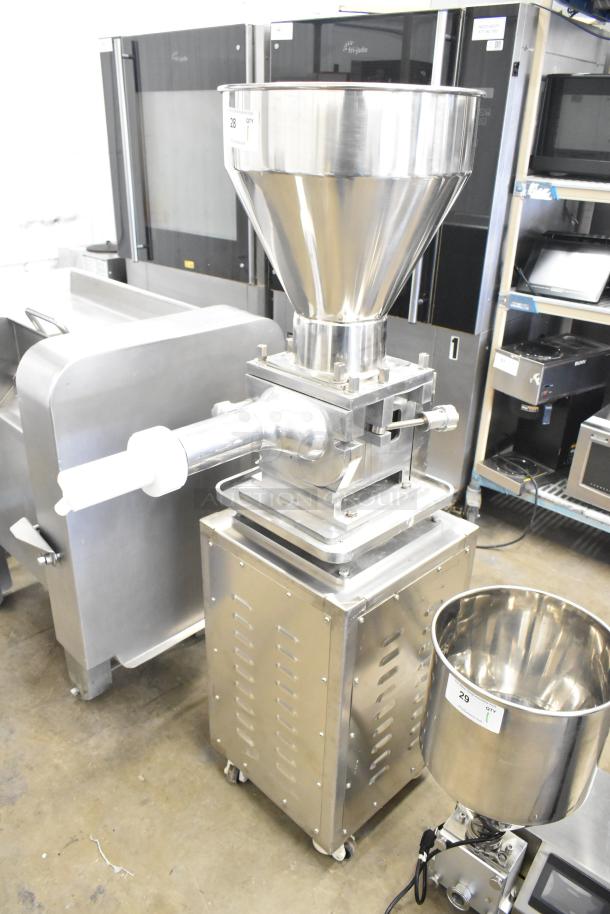 Luohe Orange commercial floor style filling machine with stainless steel hopper. 220V, 3 phase, on casters. Appears in good condition.