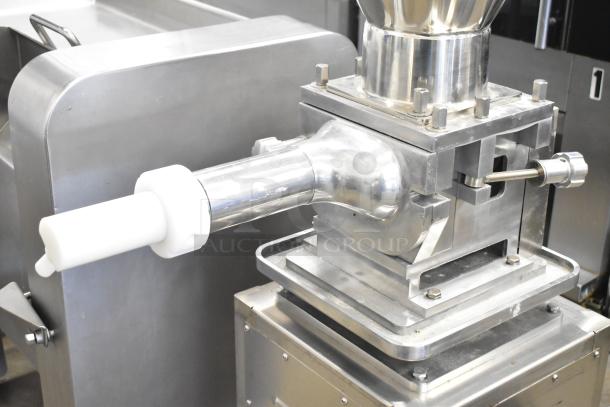 Luohe Orange commercial floor filling machine, stainless steel, on casters. 220V, 3 phase. Clean, used condition.