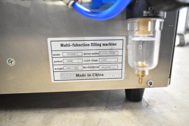 2023 ZD200E-1 Pastry Donut Filling Machine, 110V, 1 Phase, stainless steel finish, with labeling for model, power, and factory number.