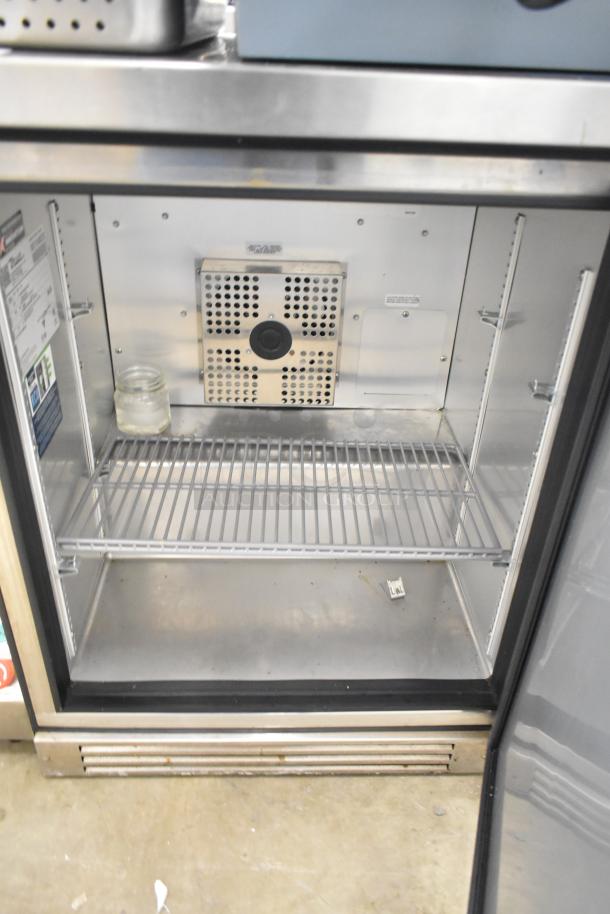 2021 True TUC-24F-HC commercial undercounter freezer with single door, on casters. Interior view, 115V, 1 phase.