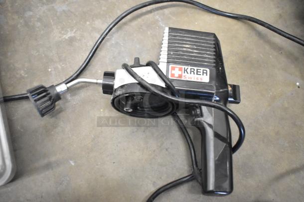 Alt text: KREA Swiss device with attached hose on concrete floor, part of mixed item auction lot including CAL-6B Calculagraph.