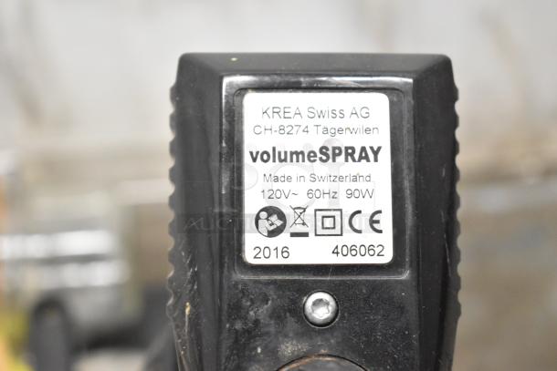 Krea Swiss AG volumeSPRAY, 120V, 60Hz, 90W, made in Switzerland, label visible on black device with screw.