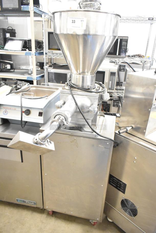 Luohe Orange commercial floor filling machine on casters, 220V, 3-phase. Features a large hopper and stainless steel finish.