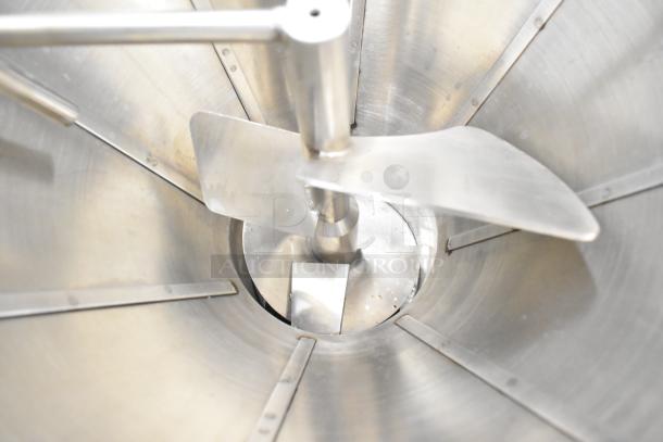 Inside view of Luohe Orange floor-style filling machine hopper, showcasing stainless steel mixing paddles. Used condition.