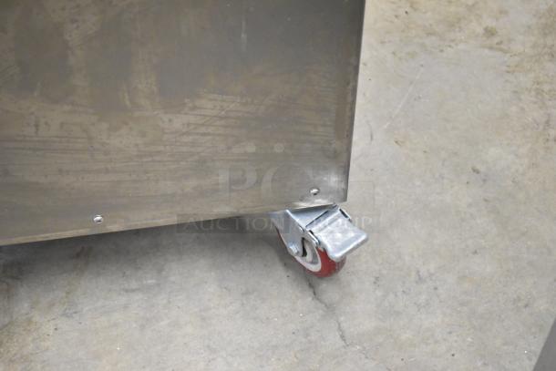 Luohe Orange commercial filling machine, floor style, stainless steel, on casters. 220V, 3-phase. Industrial-grade.