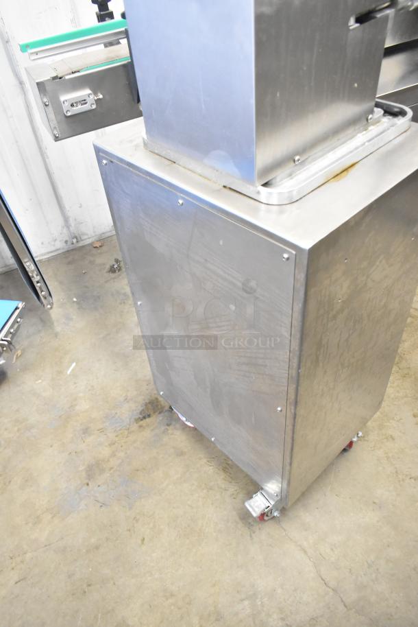 Luohe Orange commercial floor filling machine on casters, 220V, 3-phase. Stainless steel finish, industrial condition.