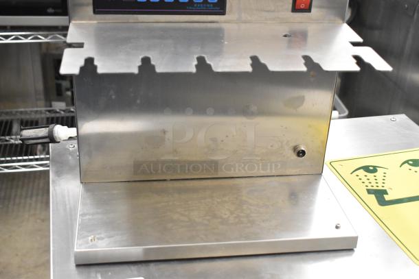 Commercial countertop 6-head automatic spout pouch filling machine, stainless steel, used condition, high accuracy liquid filler.