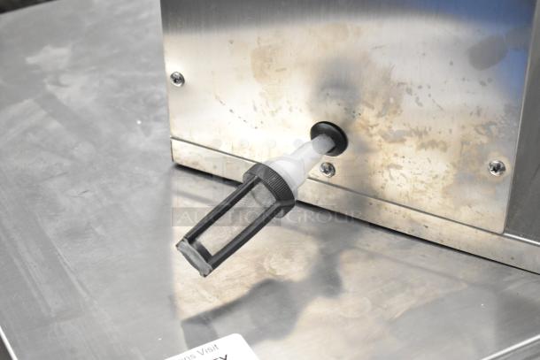 Commercial countertop spout pouch filling machine, 6-head, automatic hot liquid filler, stainless steel, used condition.