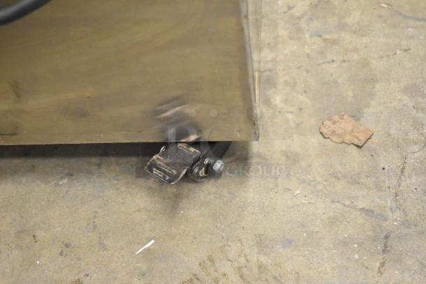 2023 C12 Countertop Semi Automatic Round Bottle Labeling Machine, visible caster, 220 Volts, 1 Phase, minor wear.