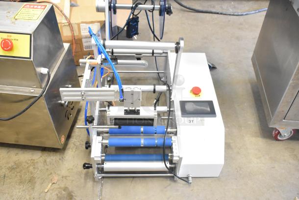 2023 C12 Countertop Semi-Automatic Round Bottle Labeling Machine, 220V, 1 Phase, with control panel and blue rollers.