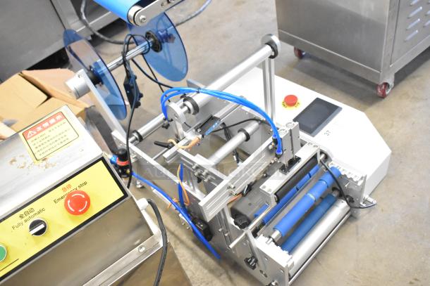 2023 C12 Countertop Semi Automatic Round Bottle Labeling Machine in excellent condition, 220V, 1 Phase, with emergency stop button.