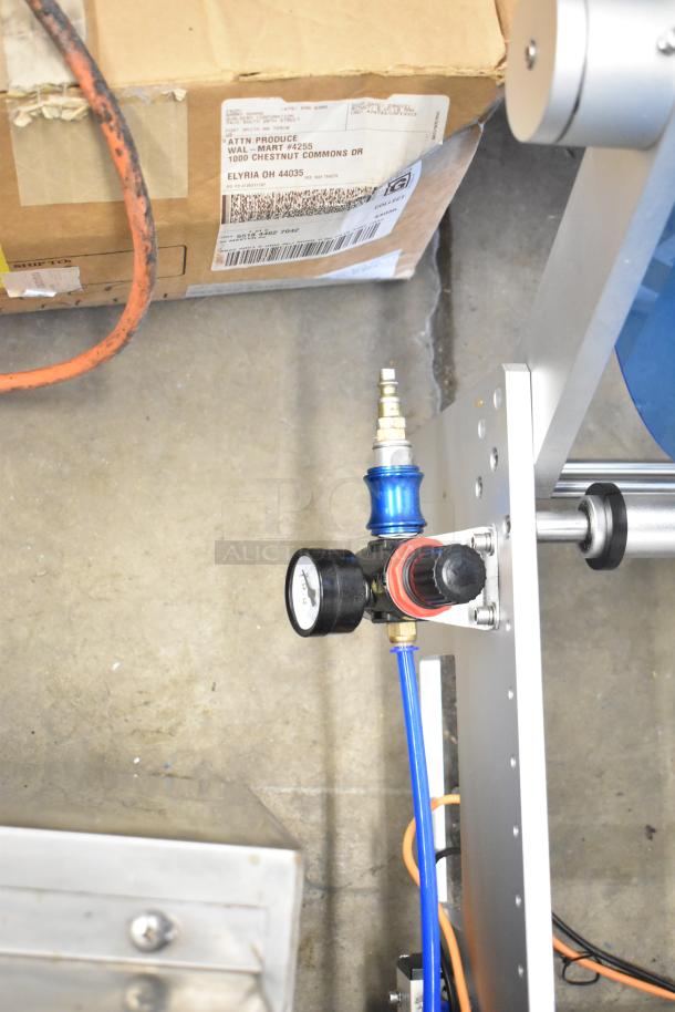 2023 C12 countertop semi-automatic round bottle labeling machine, 220V, 1 phase, with adjustable components and pressure gauge.