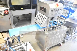 Seny Machinery commercial slicer and conveyor machine on casters, 220 volts, stainless steel, excellent condition.