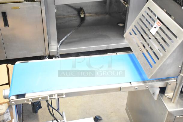 Seny Machinery commercial slicer and conveyor on casters, 220V, stainless steel, with blue belt and vented panel.