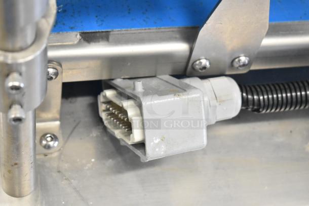 Seny Machinery commercial slicer, conveyor with stainless steel frame. Features electrical connector and casters. 220 volts.