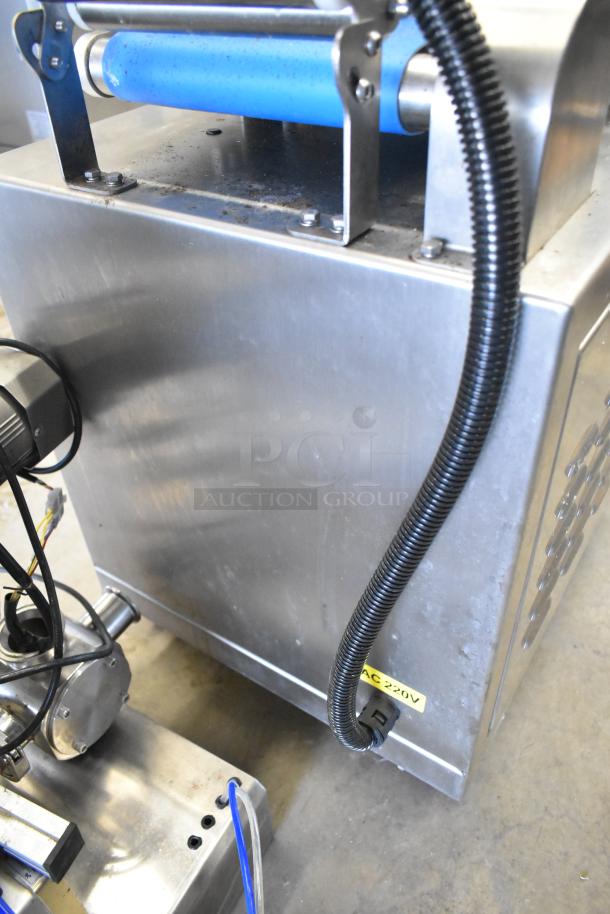 Seny Machinery commercial slicer and conveyor machine on casters, 220V, stainless steel, used condition, wiring visible.