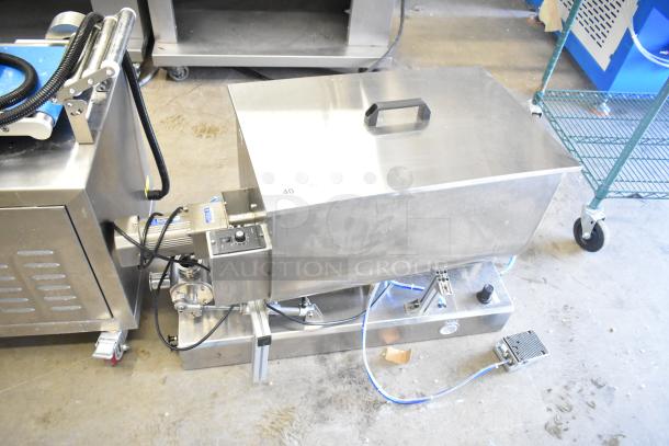 Commercial countertop meat mixer with foot pedal, stainless steel exterior, visible control panel, used condition.
