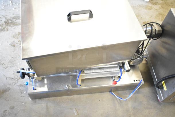 Commercial countertop meat mixer with foot pedal, stainless steel, sturdy build, excellent condition, with visible wiring.