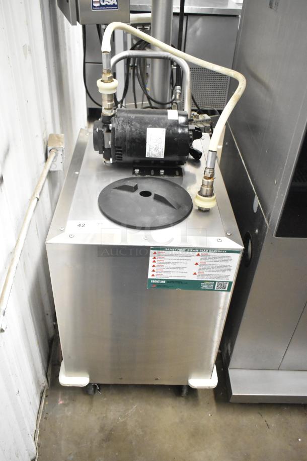 Frontline commercial fryer oil transport on casters, features pump mechanism, visible safety label, stainless steel body.