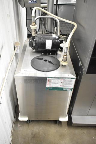 Frontline commercial fryer oil transport on casters, features pump mechanism, visible safety label, stainless steel body.
