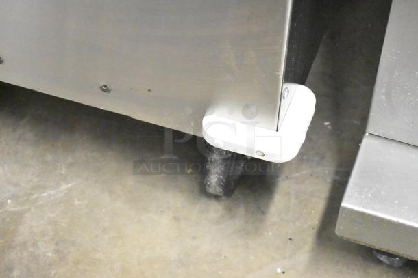 Frontline Commercial Fryer Oil Transport on casters, metal, shows corner detail and wheel, in good condition.