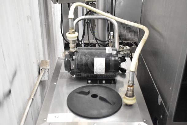 Frontline Commercial Fryer Oil Transport with casters, features a sturdy metal base, attached motor, and visible control labels.