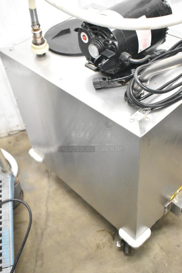 Frontline commercial fryer oil transport unit on casters, stainless steel, features hose and motor, in good condition.