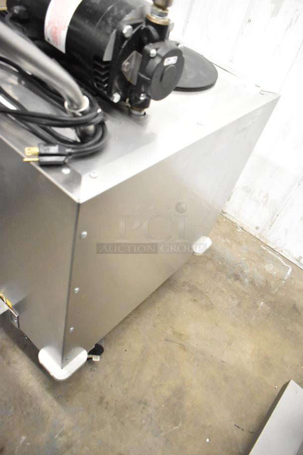 Frontline Commercial Fryer Oil Transport on casters. Stainless steel, includes pump and power cord, in good condition.