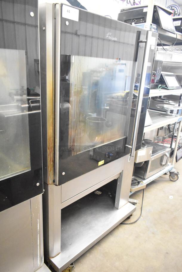 Fri-jado TDR7-P electric rotisserie oven, commercial floor style, on casters. Used condition, 208V, 3-phase, exterior staining visible.