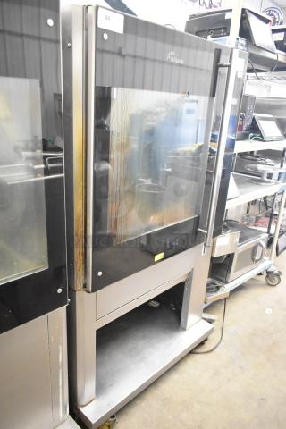 Fri-jado TDR7-P electric rotisserie oven, commercial floor style, on casters. Used condition, 208V, 3-phase, exterior staining visible.