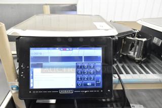 2017 Hobart HTi-7LH26 metal countertop food scale. Touchscreen display, good condition, 120/208-240V, 1 phase. Tested and working.