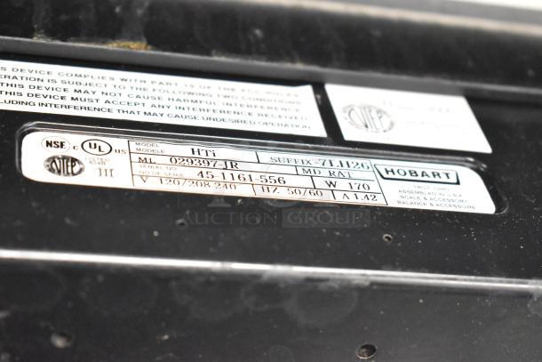 2017 Hobart HTi-7LH26 metal commercial scale label, showing model and serial numbers, voltage and certifications.