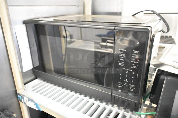 2024 Mainstays MS8436193153-03 countertop microwave, black, digital controls, 120V, 1 phase, visible signs of light use.